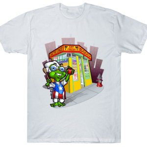 White t-shirt with a green character, wearing glasses & an American flag-inspired outfit, standing in front of a store.